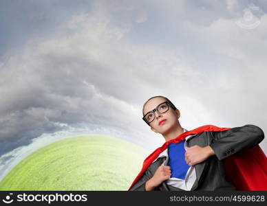 To be super woman takes strength. Businesswoman wearing red cape and opening her shirt like superhero