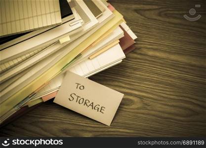 To Storage; The Pile of Business Documents on the Desk