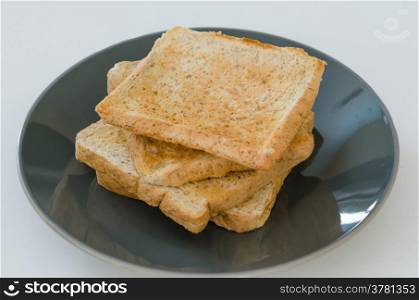 toast bread. close up of slice toast bread on black dish
