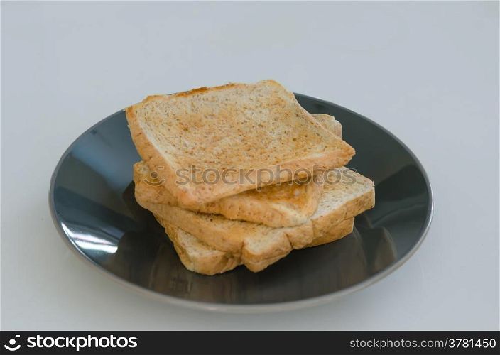 toast bread. close up of slice toast bread on black dish