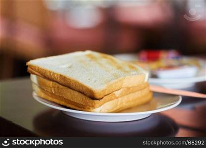 Toast bread in a white plate
