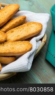 Toast bread on a wooden table in a bread basket.