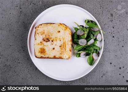 Toast Croc Monsieur with green salad