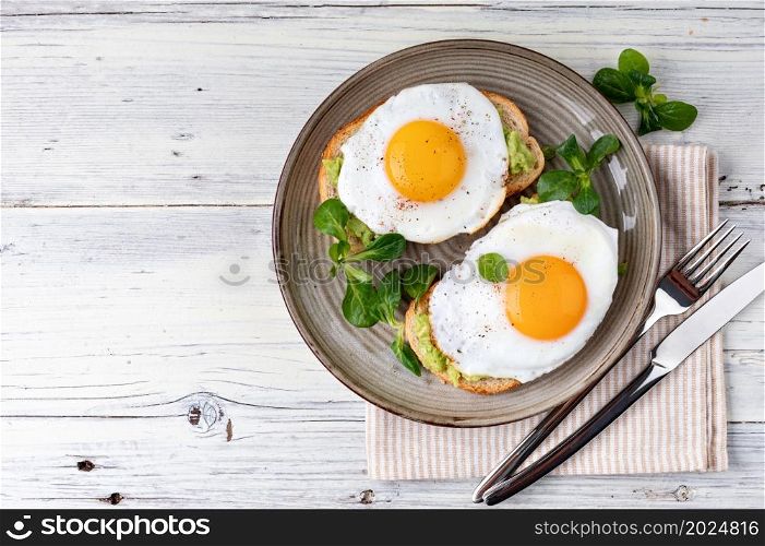 toast with fried egg, top view. toast with fried egg