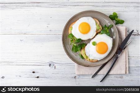 toast with fried egg, top view. toast with fried egg