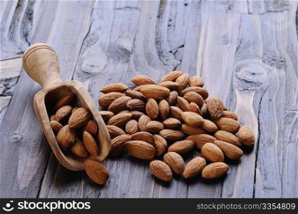 Toasted almonds on the wooden table in the kitchen.