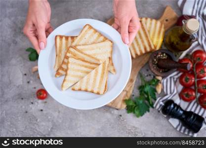 Toasted Bread Slices on wooden cutting board for breakfast.. Toasted Bread Slices on wooden cutting board for breakfast