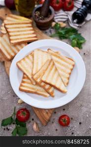 Toasted Bread Slices on wooden cutting board for breakfast.. Toasted Bread Slices on wooden cutting board for breakfast