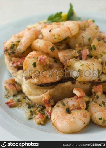 Toasted Brioche topped with Prawns cooked In Lobster Garlic Butter