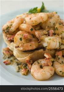 Toasted Brioche topped with Prawns cooked In Lobster Garlic Butter