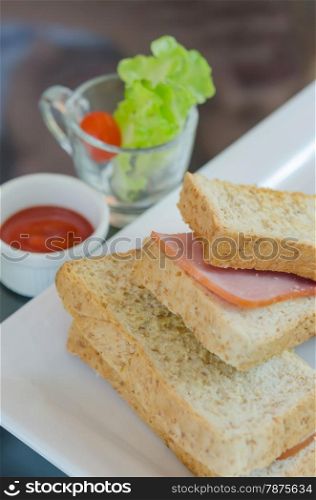 toasted sandwich. close up toasted sandwich with ham and cheese on dish