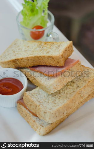 toasted sandwich. close up toasted sandwich with ham and cheese on dish