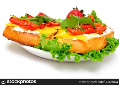 Toasted sliced sourdough bread topped with Ricotta and sharp cheddar cheese and roasted red bell pepper with a sprig of cilantro served on a bed of green lettuce and white saucer. Cheese And Pepper Sandwich