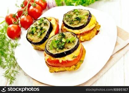 Toasted with egg, tomato, cheese and eggplant slices of bread, sprinkled with dill and parsley in a plate on napkin on light wooden table top