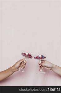 toasting with confetti filled glasses