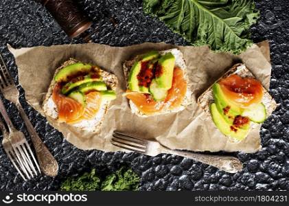 toasts with avocado and fresh salmon fish