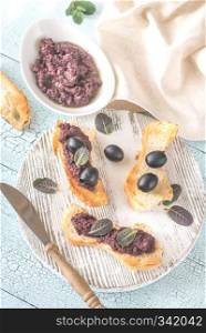 Toasts with black olive pate