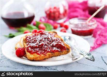 toasts with raspberry jam on the plate