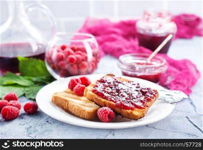 toasts with raspberry jam on the plate