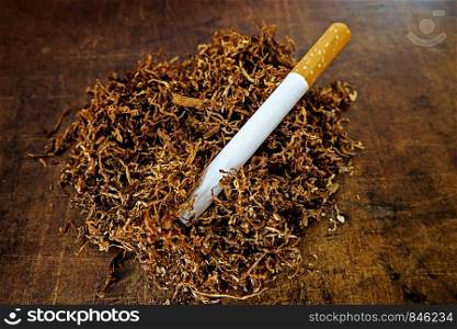 Tobacco and empty cigarette tube to stuff itself