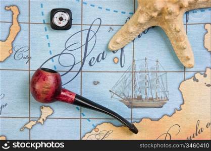 tobacco pipe and a starfish on a stylized map