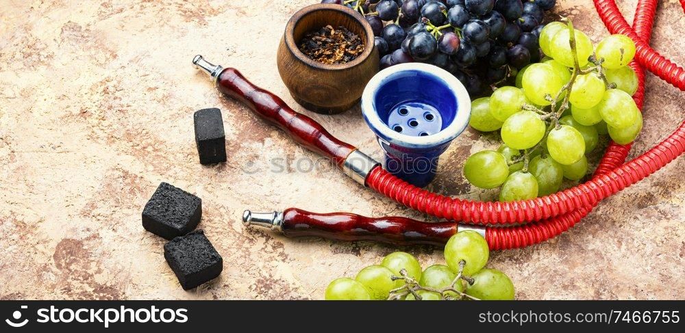 Tobacco shisha with grapes flavor.Nargile with grapes.Turkish fruit hookah tobacco. Hookah with grapes taste