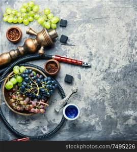 Tobacco shisha with grapes flavor.Nargile with grapes.Turkish fruit hookah tobacco. Kalian with grapes taste