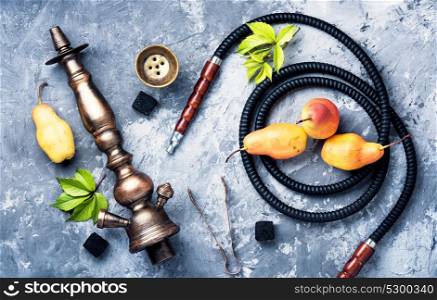 tobacco smoking hookah with pear. oriental shisha with tobacco aroma of pear