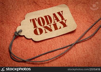 today only text on a paper price tag with a twine against textured bark paper, shopping and marketing concept