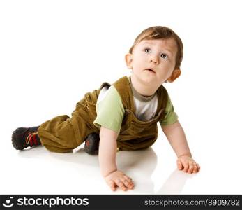 Toddler boy lying on floor isolated on white