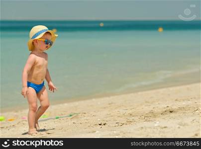 Toddler boy on beach . Two year old toddler boy on beach