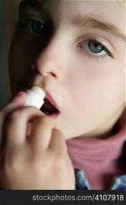 toddler girl and coconut oil lipstick close contrasted light portrait