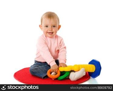 Toddler girl playing with pyramid isolated on white