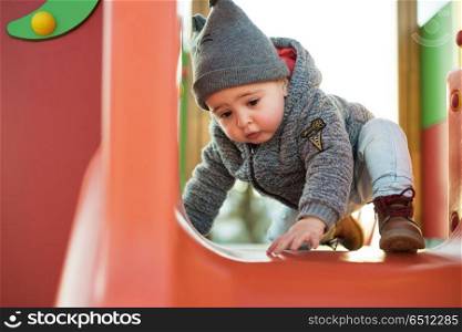 Toddler having fun. Little boy having fun on a toddler park