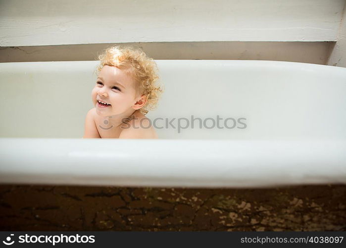 Toddler inside bathtub
