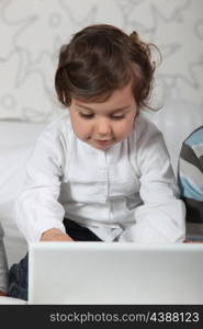 Toddler using laptop