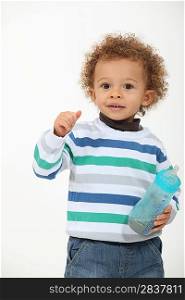 Toddler with milk bottle