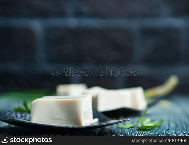 tofu cheese on plate and on a table