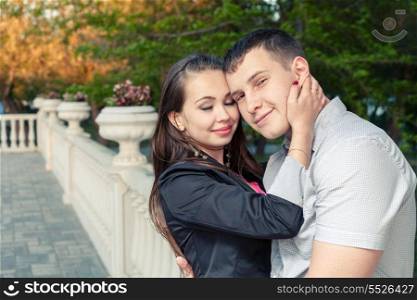 Together and very happy. Cute couple embracing