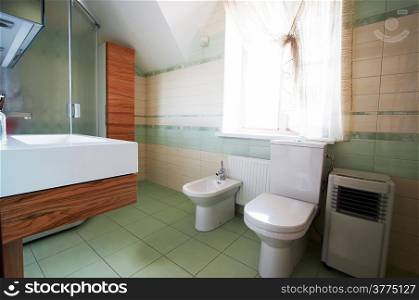 Toilet bowl and bidet in a modern bathroom