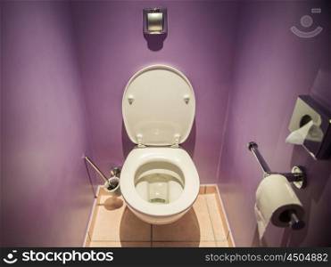 Toilet seat in modern room