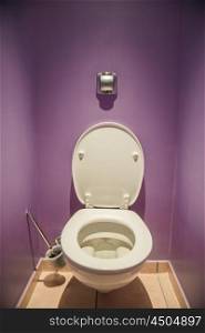 Toilet seat in modern room