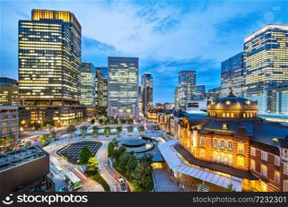 Tokyo city skyline at railway station surround by modern highrise building at twilight time. Tokyo city, Japan.. Tokyo city skyline at railway station surround by modern highrise building at twilight time.