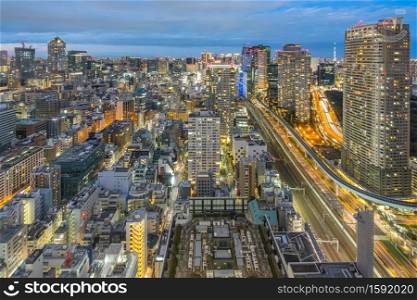 Tokyo city skyline with landmark buildings in Tokyo, Japan at night.
