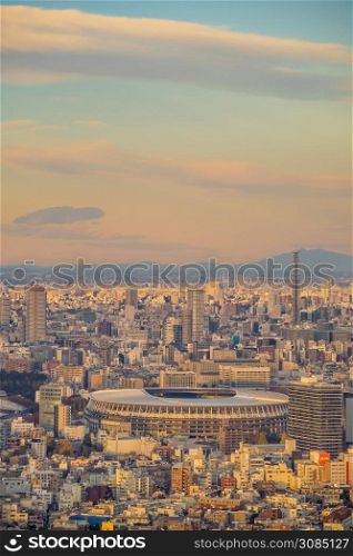 TOKYO, JAPAN - DECEMBER 5, 2019: The New National Stadium, Olympic Stadium in Tokyo, Japan from topview at sunset