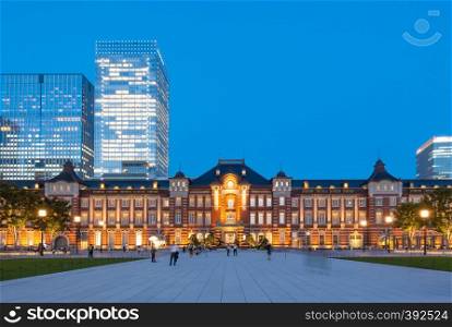 Tokyo railway station and Tokyo highrise building at twilight time in Tokyo