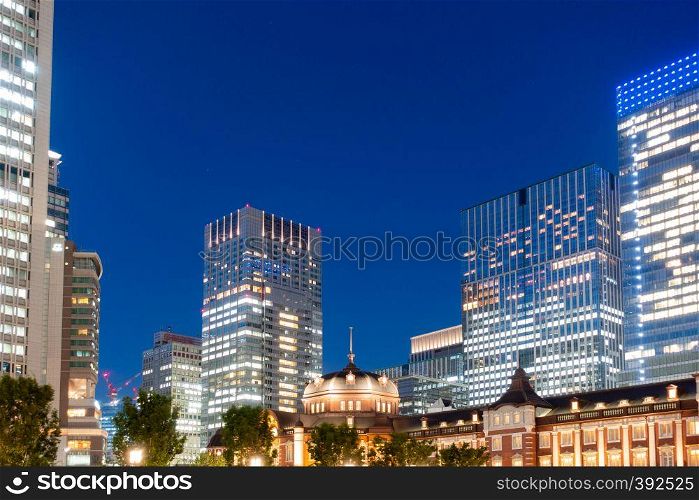 Tokyo railway station and Tokyo highrise building at twilight time in Tokyo
