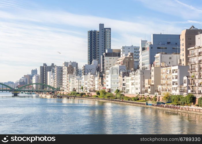 Tokyo skyline along sumida river Japan