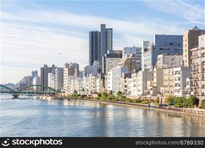 Tokyo skyline along sumida river Japan