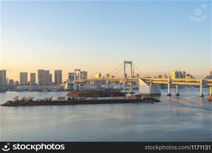 Tokyo skyline with view of Rainbow bridge in Japan.